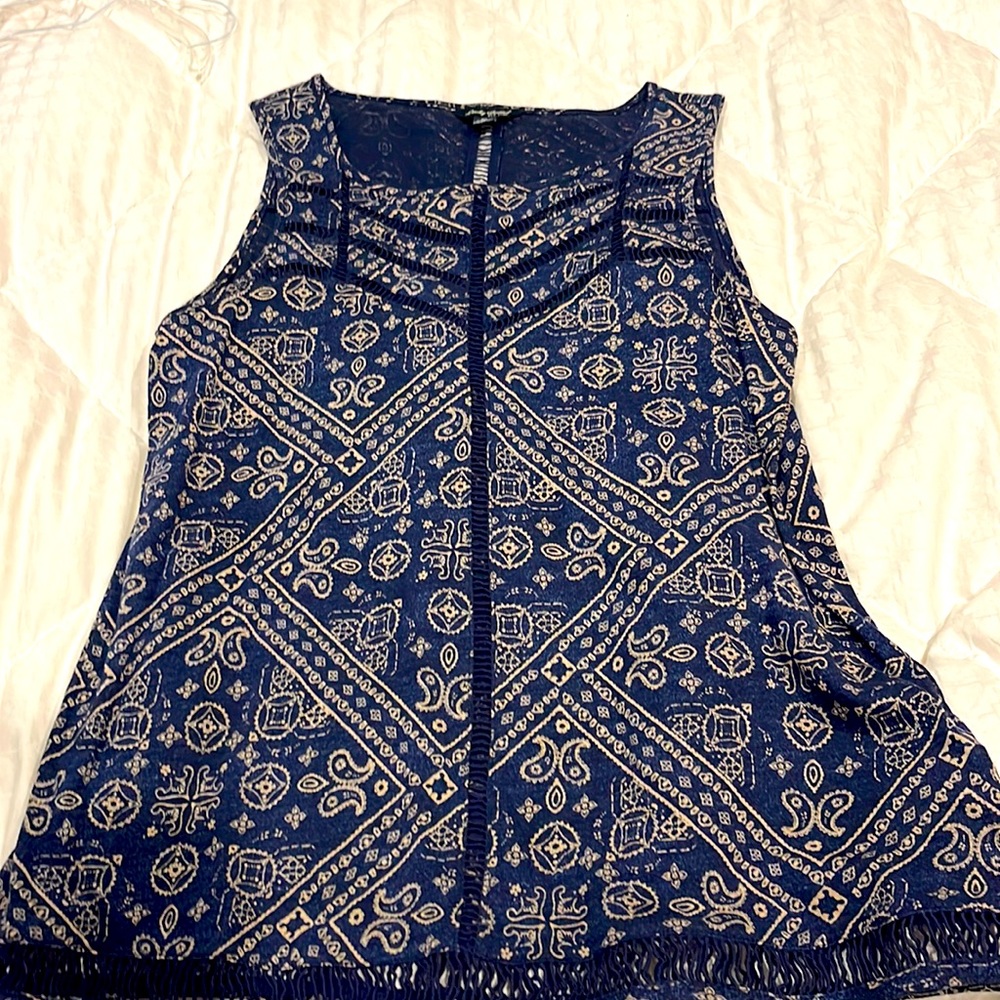 Dressy navy and tan tank top.  Small cutouts along the hem.  Worn once